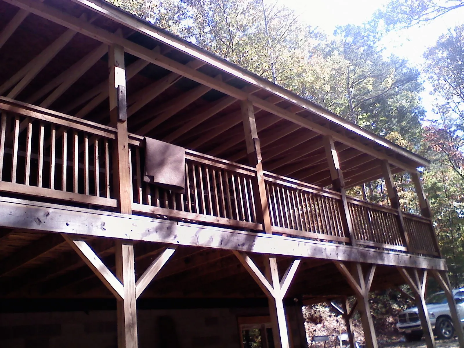 Timber framing under a new elevated porch and deck — Roof Leak Repair in West Sunbury by Roofing Brothers